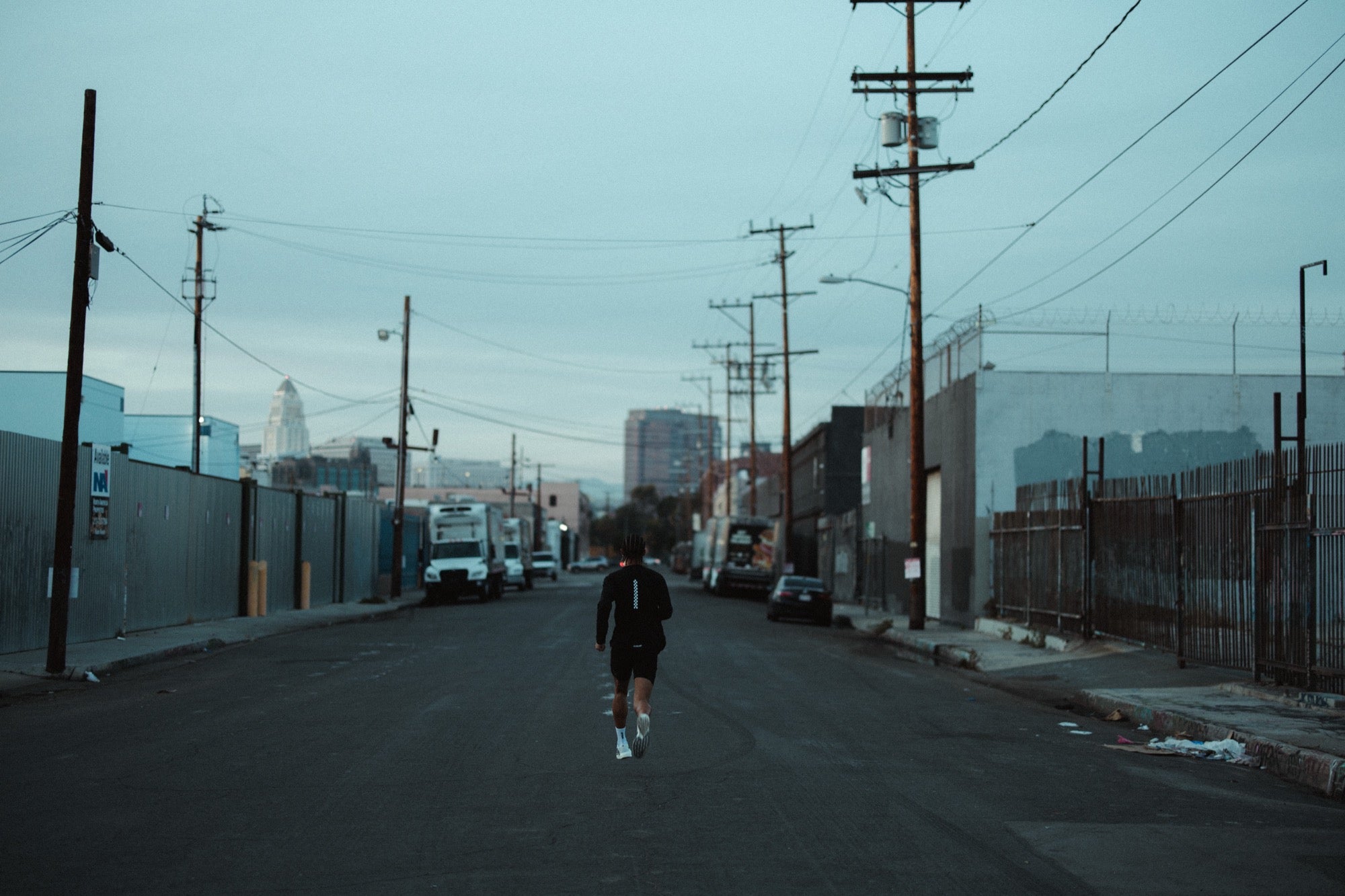 Runner on a road at dusk